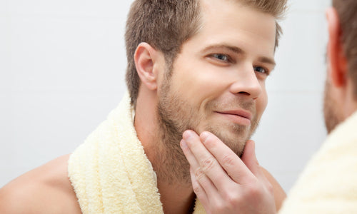 man looking into mirror