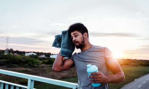 man wiping sweat