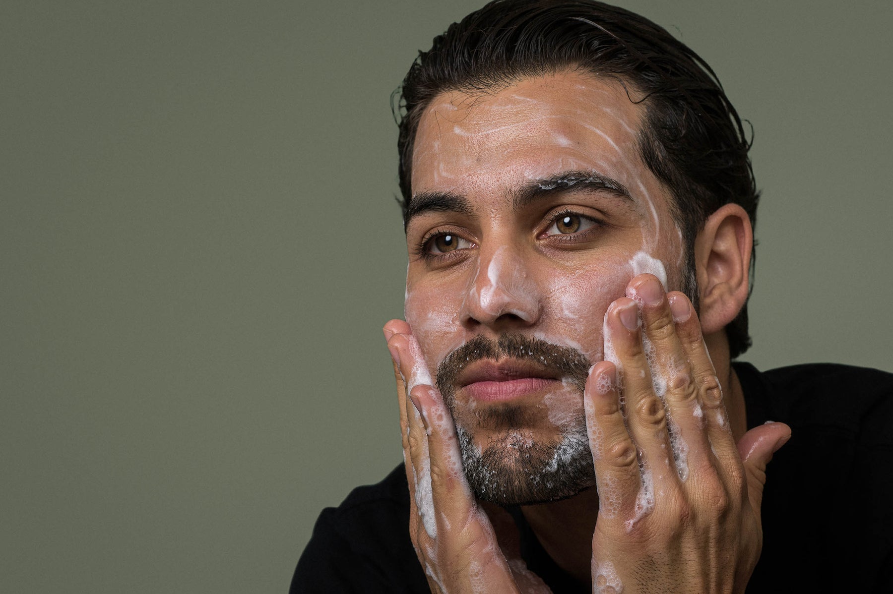 Man washing his face